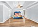 Spacious main bedroom with tray ceiling, ceiling fan, and ample natural light, creating a peaceful retreat at 3670 Cedar Springs Ln, Loganville, GA 30052