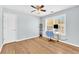 Office features a desk, chair, shelving and hardwood floors at 3670 Cedar Springs Ln, Loganville, GA 30052