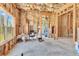 Unfinished room with large windows, cement floor, and exposed insulation at 3670 Cedar Springs Ln, Loganville, GA 30052