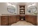 Bathroom with a double vanity, granite countertops, and dark wood cabinets at 4732 Corina Ne Pl, Roswell, GA 30075