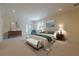 Comfortable bedroom featuring neutral decor, a bed with decorative pillows, and ample natural light at 4732 Corina Ne Pl, Roswell, GA 30075