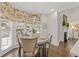 Bright eat-in breakfast nook with hardwood floors and view of the garden at 4732 Corina Ne Pl, Roswell, GA 30075