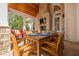 Covered patio with brick fireplace, wood ceiling, and outdoor dining set at 4732 Corina Ne Pl, Roswell, GA 30075