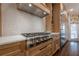Well-equipped kitchen with stainless steel appliances, custom cabinets, and stylish backsplash at 4732 Corina Ne Pl, Roswell, GA 30075