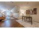 Bonus room offers versatile space featuring a desk, seating area, hardwood floors and ample lighting at 4732 Corina Ne Pl, Roswell, GA 30075