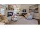 Bright living room with fireplace, hardwood floors, and comfortable seating at 4732 Corina Ne Pl, Roswell, GA 30075