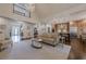 Open-concept living room with hardwood floors connecting to the kitchen and entryway at 4732 Corina Ne Pl, Roswell, GA 30075