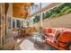 Expansive outdoor patio area with a stone floor, dining table, and comfortable seating at 4732 Corina Ne Pl, Roswell, GA 30075