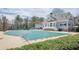 Community pool covered for the off-season, surrounded by lush greenery and offering a relaxing atmosphere at 4732 Corina Ne Pl, Roswell, GA 30075