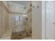 Tiled shower with glass enclosure and built-in seating at 4732 Corina Ne Pl, Roswell, GA 30075