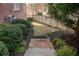 Landscaped yard with stone steps and vibrant greenery, providing a serene outdoor space at 4732 Corina Ne Pl, Roswell, GA 30075