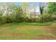 Large, green backyard offering ample space for outdoor activities at 4974 Meadow Ln, Marietta, GA 30068