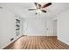 Open Bedroom with ceiling fan, windows, and hardwood floors at 4974 Meadow Ln, Marietta, GA 30068
