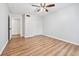 Light-filled bedroom featuring beautiful hardwood floors and a ceiling fan at 4974 Meadow Ln, Marietta, GA 30068