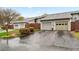 Charming townhome exterior with well-maintained garages and blossoming landscaping at 4974 Meadow Ln, Marietta, GA 30068