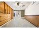 Unfinished garage with wood paneling, concrete floor, and a door leading to the house at 4974 Meadow Ln, Marietta, GA 30068