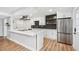 Bright kitchen with stainless steel appliances, black backsplash, and quartz countertops at 4974 Meadow Ln, Marietta, GA 30068