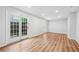 Bright living room with hardwood floors and glass door at 4974 Meadow Ln, Marietta, GA 30068