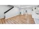 Open-concept living area with modern flooring and staircase at 4974 Meadow Ln, Marietta, GA 30068