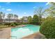 A refreshing community pool with clear blue water and trees in the background at 4974 Meadow Ln, Marietta, GA 30068