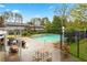 Community pool area featuring poolside seating and a lush green landscape at 4974 Meadow Ln, Marietta, GA 30068