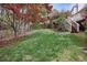 Backyard with grass and a staircase that leads to an elevated back porch at 6227 Braidwood Nw Way, Acworth, GA 30101