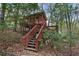 Backyard building with stairs and a covered porch at 6227 Braidwood Nw Way, Acworth, GA 30101