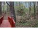 Backyard with a walking bridge leading to a small building with a slide at 6227 Braidwood Nw Way, Acworth, GA 30101