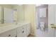 Bathroom with white vanity, and separate tub and toilet area at 6227 Braidwood Nw Way, Acworth, GA 30101