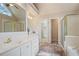 Bathroom features double sinks, walk-in closet, tub, and tiled floors at 6227 Braidwood Nw Way, Acworth, GA 30101