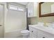Bathroom features a tub and shower combination and white vanity at 6227 Braidwood Nw Way, Acworth, GA 30101