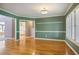 Dining room with hardwood floors, shutters on the windows, and neutral paint at 6227 Braidwood Nw Way, Acworth, GA 30101