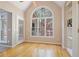 Cozy eating area with hardwood floors, a large window with backyard views, and built-in shelving at 6227 Braidwood Nw Way, Acworth, GA 30101