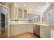 Bright kitchen features wood floors, white cabinets, stainless steel appliances, and tile backsplash at 6227 Braidwood Nw Way, Acworth, GA 30101