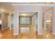 Open concept living area with hardwood floors, open floorplan, and natural light at 6227 Braidwood Nw Way, Acworth, GA 30101