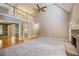 Bright living room with a fireplace, views to a second-story balcony, and large windows at 6227 Braidwood Nw Way, Acworth, GA 30101