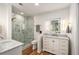Modern bathroom featuring marble counters, a glass enclosed shower, and gold fixtures at 1087 High Point Ne Dr, Atlanta, GA 30306