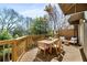 Outdoor deck area has a wooden dining table with chairs and additional seating at 1087 High Point Ne Dr, Atlanta, GA 30306