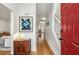 Bright foyer with a red door, hardwood floors, and a view into the living spaces at 1087 High Point Ne Dr, Atlanta, GA 30306