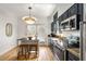 Modern kitchen boasting granite countertops, stainless steel appliances, and lots of natural light at 1087 High Point Ne Dr, Atlanta, GA 30306