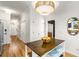 This eat-in kitchen features stainless steel appliances and leads into a hallway at 1087 High Point Ne Dr, Atlanta, GA 30306