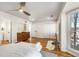 Spacious main bedroom with hardwood floors, neutral decor, and a large window at 1087 High Point Ne Dr, Atlanta, GA 30306