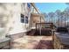 Spacious backyard patio area with stone border and patio furniture at 165 Carriage Gate Dr, Sharpsburg, GA 30277