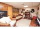 Cozy basement with seating area, shelves, unique decor, and a piano at 165 Carriage Gate Dr, Sharpsburg, GA 30277