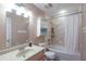 Bright bathroom featuring a shower/tub, a toilet, and vanity, with modern finishes at 165 Carriage Gate Dr, Sharpsburg, GA 30277
