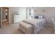 Bedroom with neutral walls, a comfortable bed, and a window offering natural light at 165 Carriage Gate Dr, Sharpsburg, GA 30277