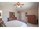 Bedroom featuring a vaulted ceiling, ceiling fan, and traditional furnishings, offering a cozy atmosphere at 165 Carriage Gate Dr, Sharpsburg, GA 30277