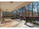 Inviting backyard deck with chaise lounges overlooking a wooded area at 165 Carriage Gate Dr, Sharpsburg, GA 30277