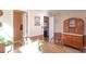 Inviting dining room with view of laundry area and vintage cabinet and wainscotting at 165 Carriage Gate Dr, Sharpsburg, GA 30277