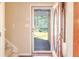 Inviting entryway showcasing a storm door and view into the front yard at 165 Carriage Gate Dr, Sharpsburg, GA 30277